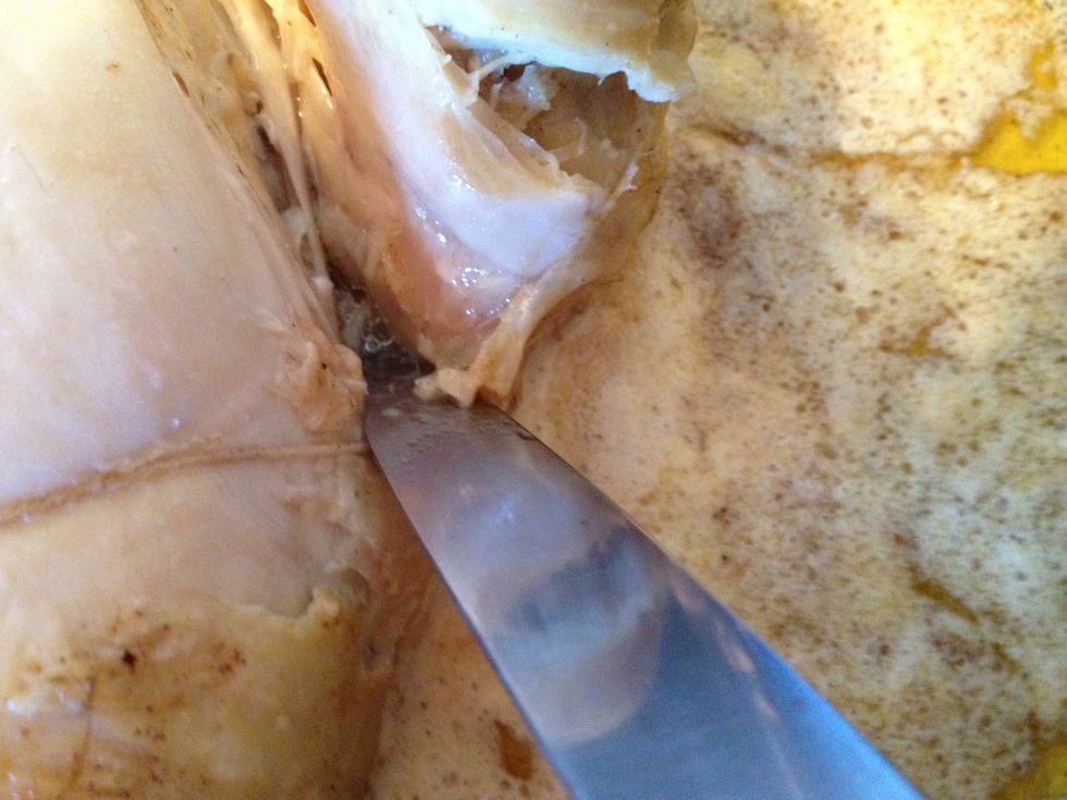 Test to see if it is done by looking at the colour of the juice between the thigh and the breast. If clear its done, if pink continue to cook for 20 minutes and then test in the other thigh.