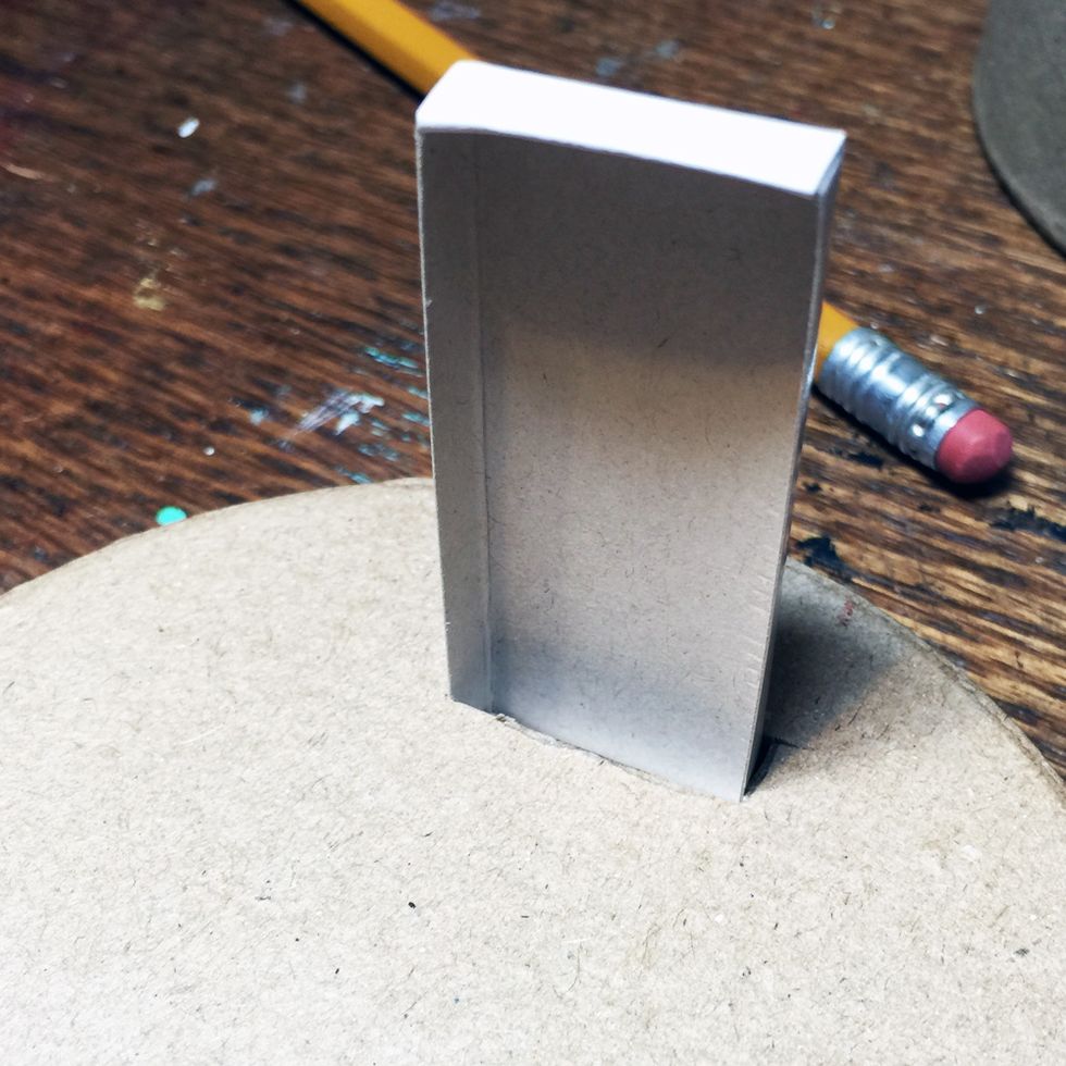 Test to see if the matchbox fits in the hole.