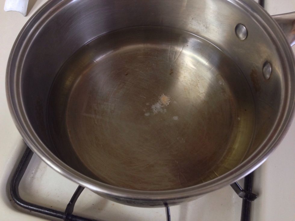Test your oil by dropping a small piece of seasoned flour into pot. If it begins to bubble and cook, it is time