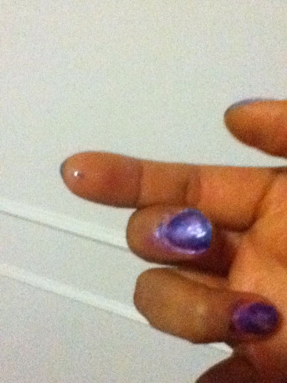 Than add a drop of of top coat in the nail to paste the shiny stones