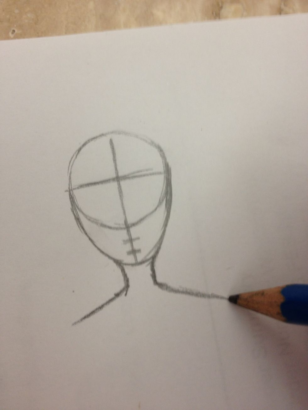 Than draw the shoulders that should be slightly longer than than the face
