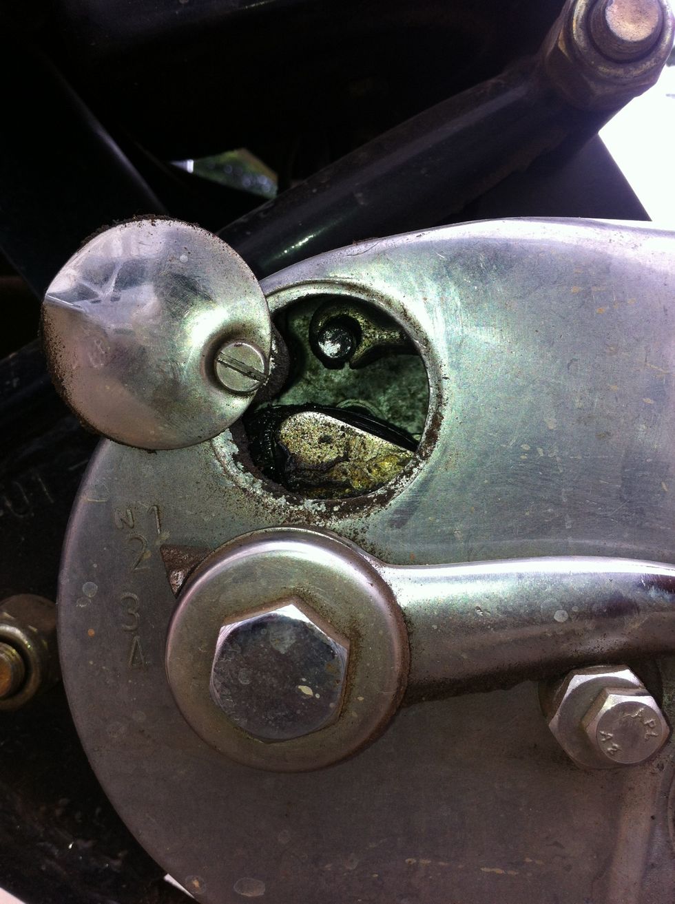 That clutch cable hook handle will move back as you loosen the screw in the previous process.