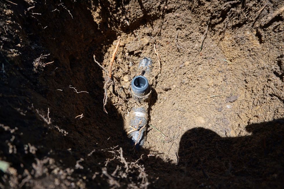 That gray fitting directly connected to the head. It was cracked and it needed to be replaced. I wouldn't know this until I dug the hole, tested the zone and checked it. Let's pretend it's OK.