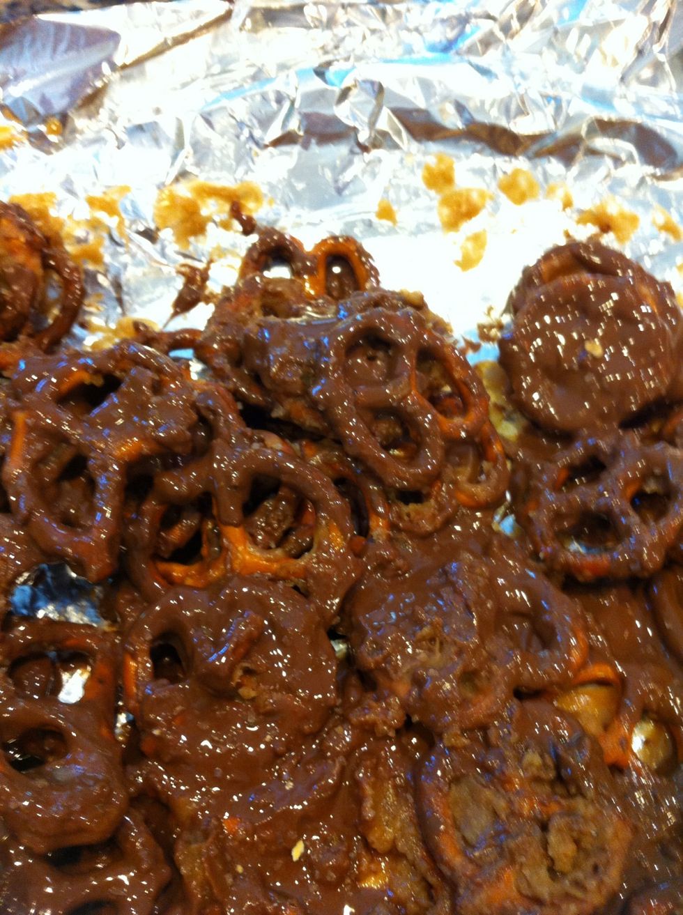 That helps soften all choc so you can spread it all over. Now is when i take some of the pretzel salt (from the bottom of the pretz bag) and sprinkle atop the chocolate.