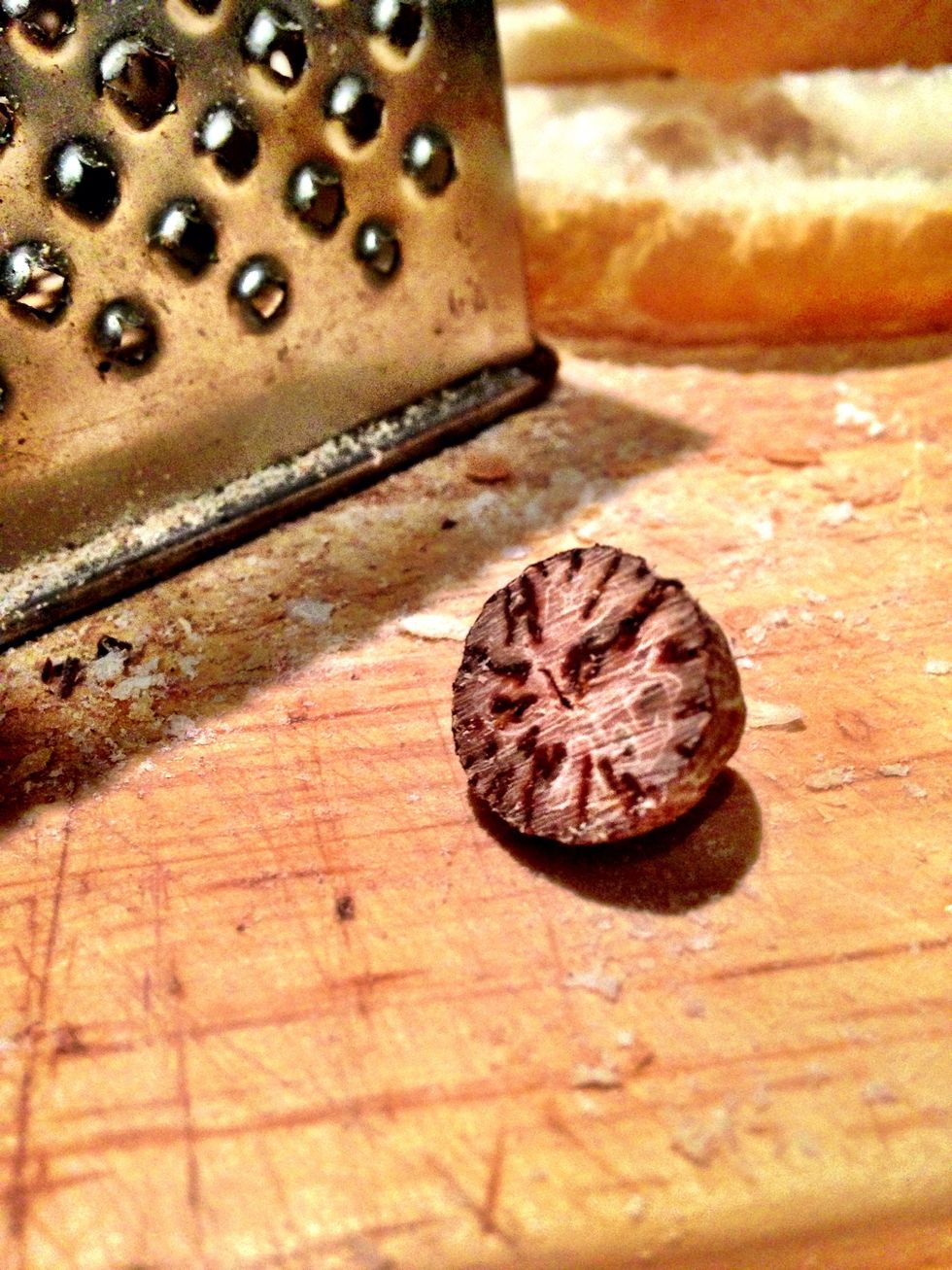 That is a piece of whole nutmeg. I like to think it is the small fossilized brain of very intelligent small animal and that the clever thoughts are what make it taste nice.