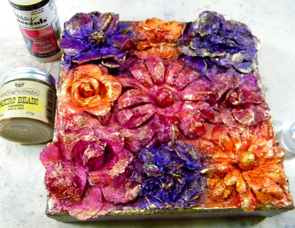 That middle flower was bugging me.  It needed something in the center.  I tried glitter and different colors of micro beads, but finally settled on copper micro beads.