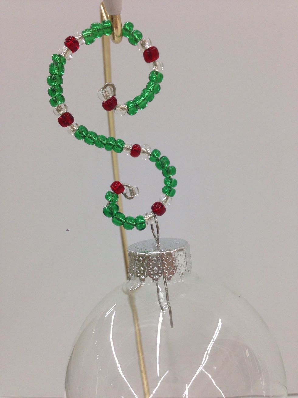 That's how easy it is to make a Sparkly S-Shaped Ornament Hanger! It will look beautiful holding a very special decoration on your tree.