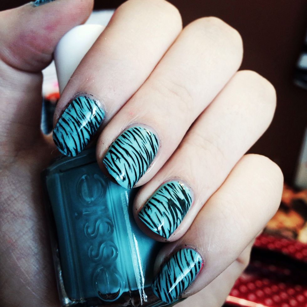 That's it! Do each nail and clean up the edges (or tape beforehand if you want), then topcoat! There are thousands of plates and endless looks to create!