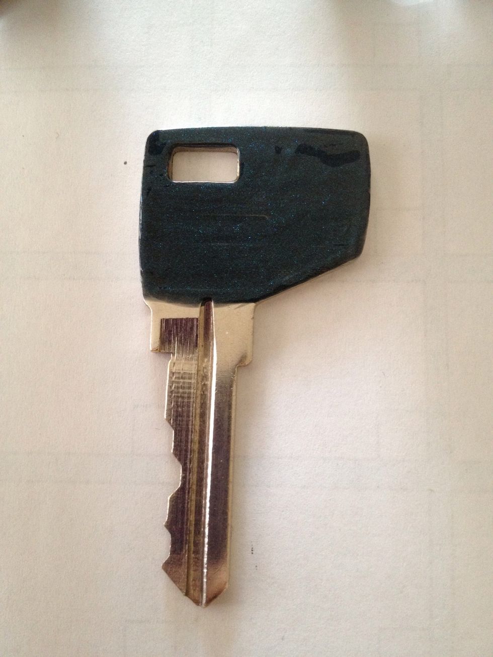 That's the blueish green key with two coats on. I liked how the polish filled in the manufacturing logo.