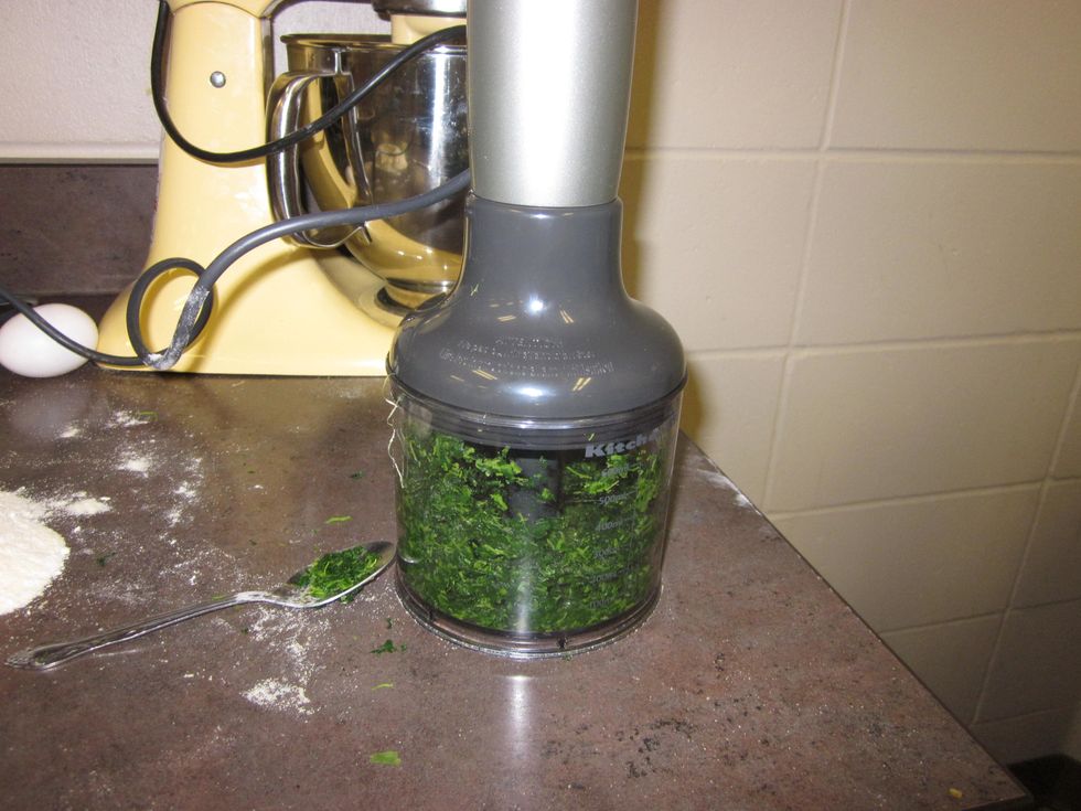 Thaw out the spinach and press out as much liquid as possible. Use the immersion blender food processor attachment to blend into very small pieces, nearly a paste.