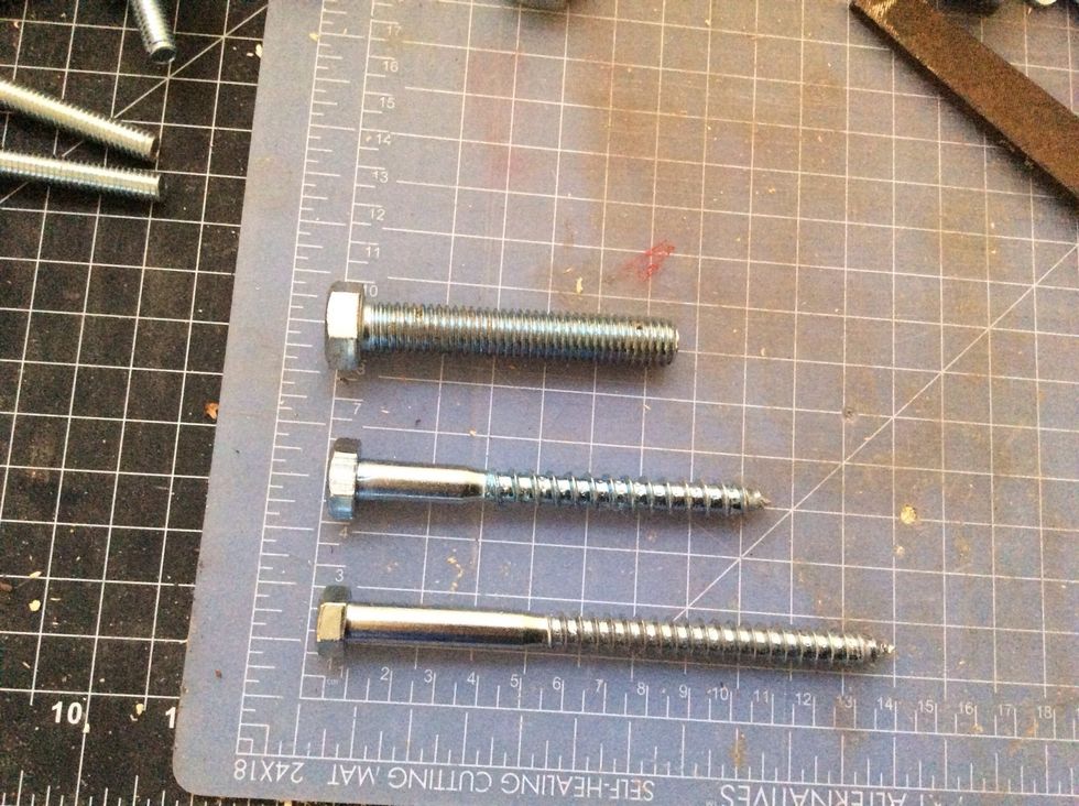 The 2 bottom bolts I used on either end of the rack to secure it to the wall. The pegs I spaced evenly between.