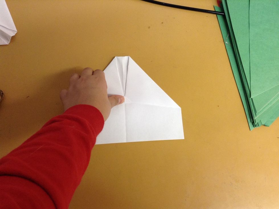 The 2 folds that you just made will keep on opening up,so fold it like this so they won't open up