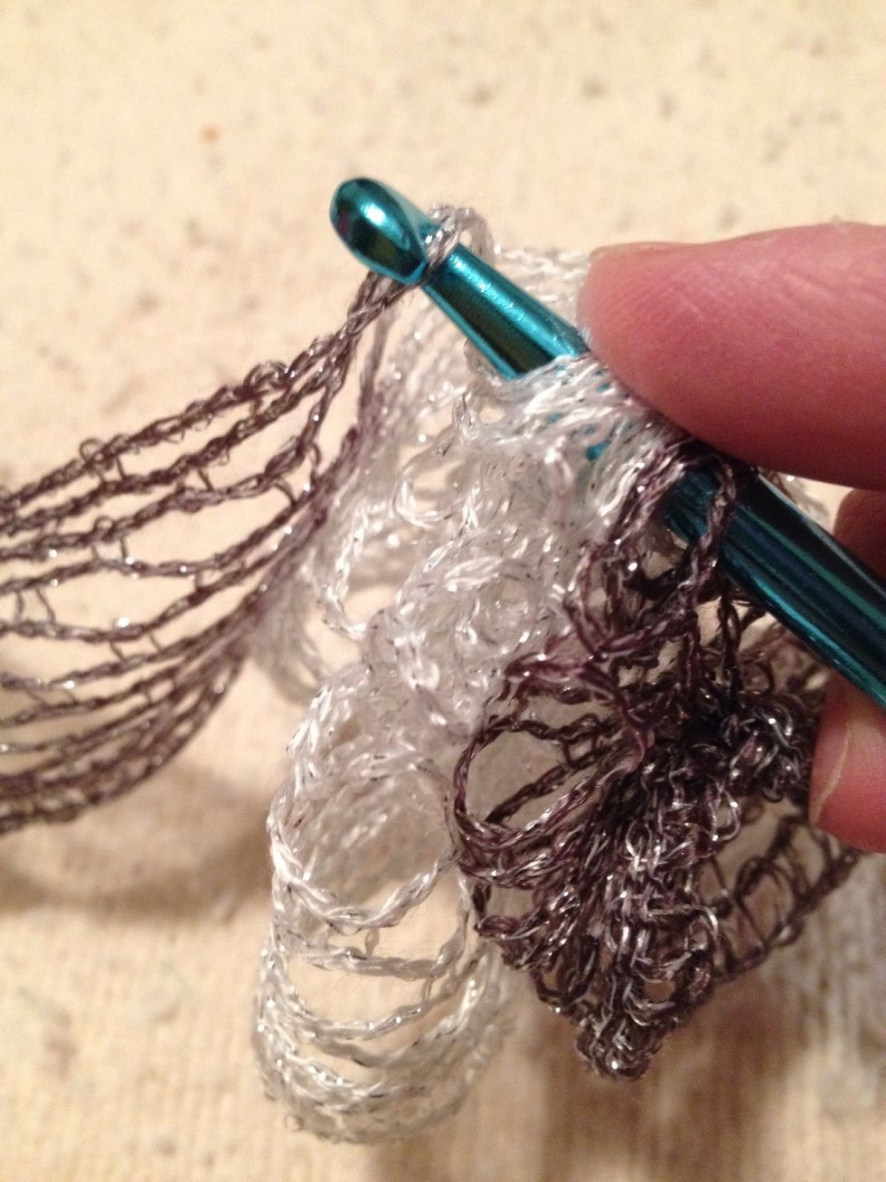 The 9th or 11th stitch gets held and pulled through all the other loops so you end with a single stitch on the hook.