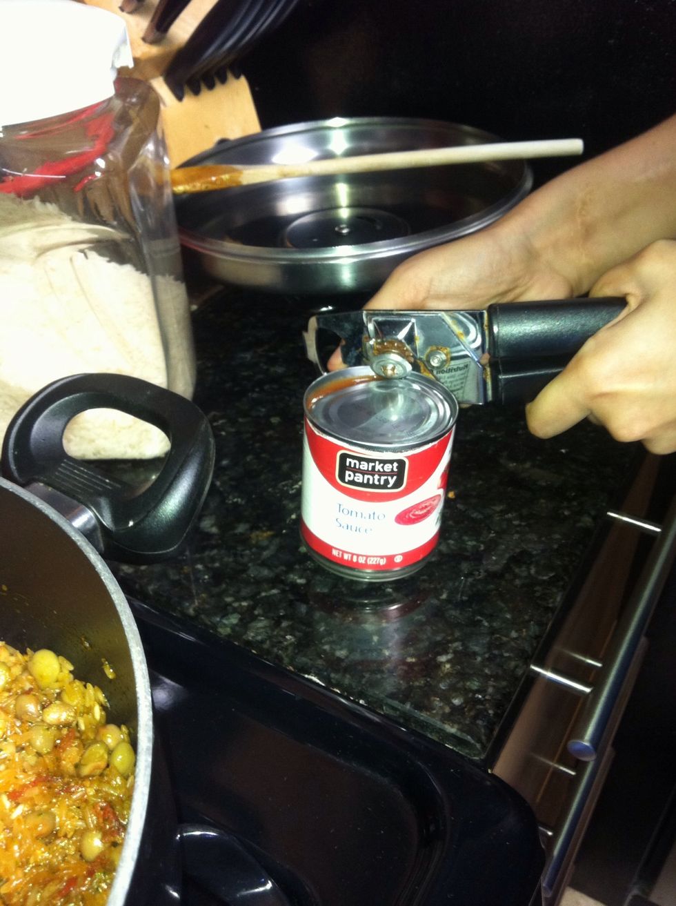 The add the entire little can of tomato sauce