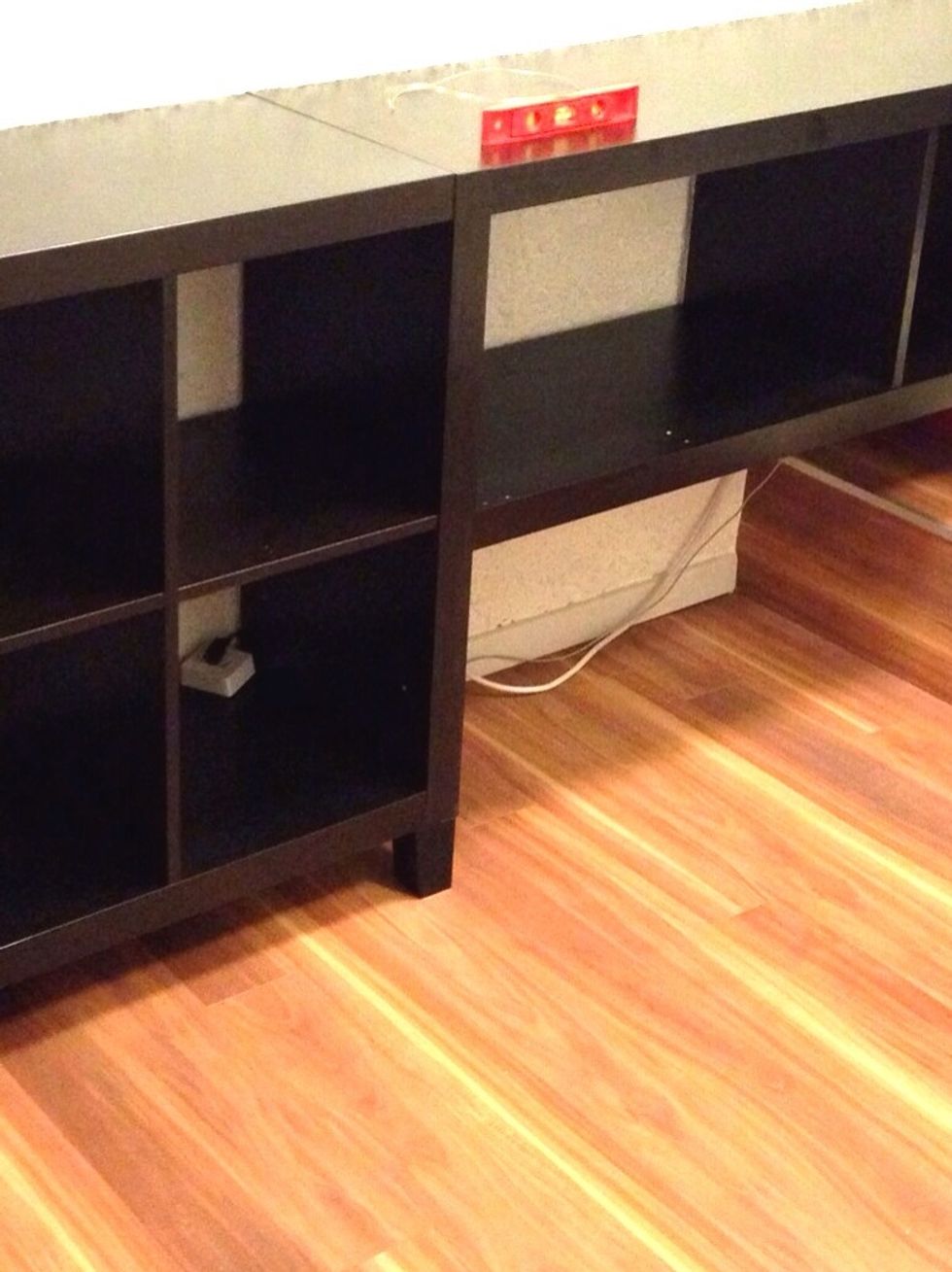 The already assembled shelf with one missing side panel.