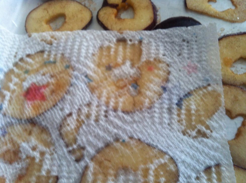 The apples start to "sweat" since sugar (like salt) extracts moisture. That\u2019s good because you want the apples as dry as possible. Use a paper towel to blot the moisture from both sides of the slices.