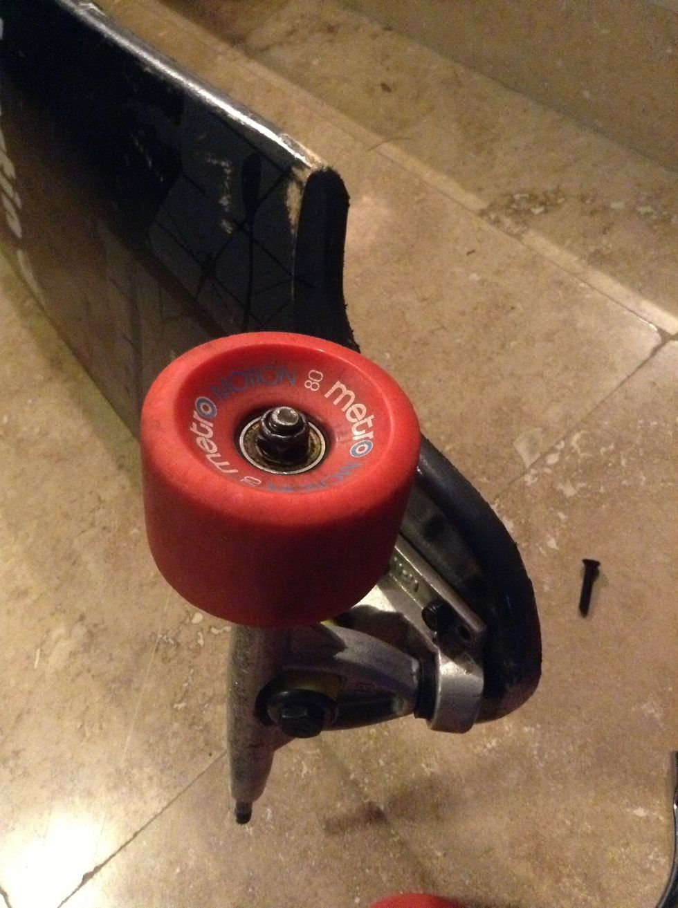 The assembled wheel components should look like this. Be sure to tighten the axle nut enough so that the wheel wont move along the axle but loose enough that the wheel will spin freely.