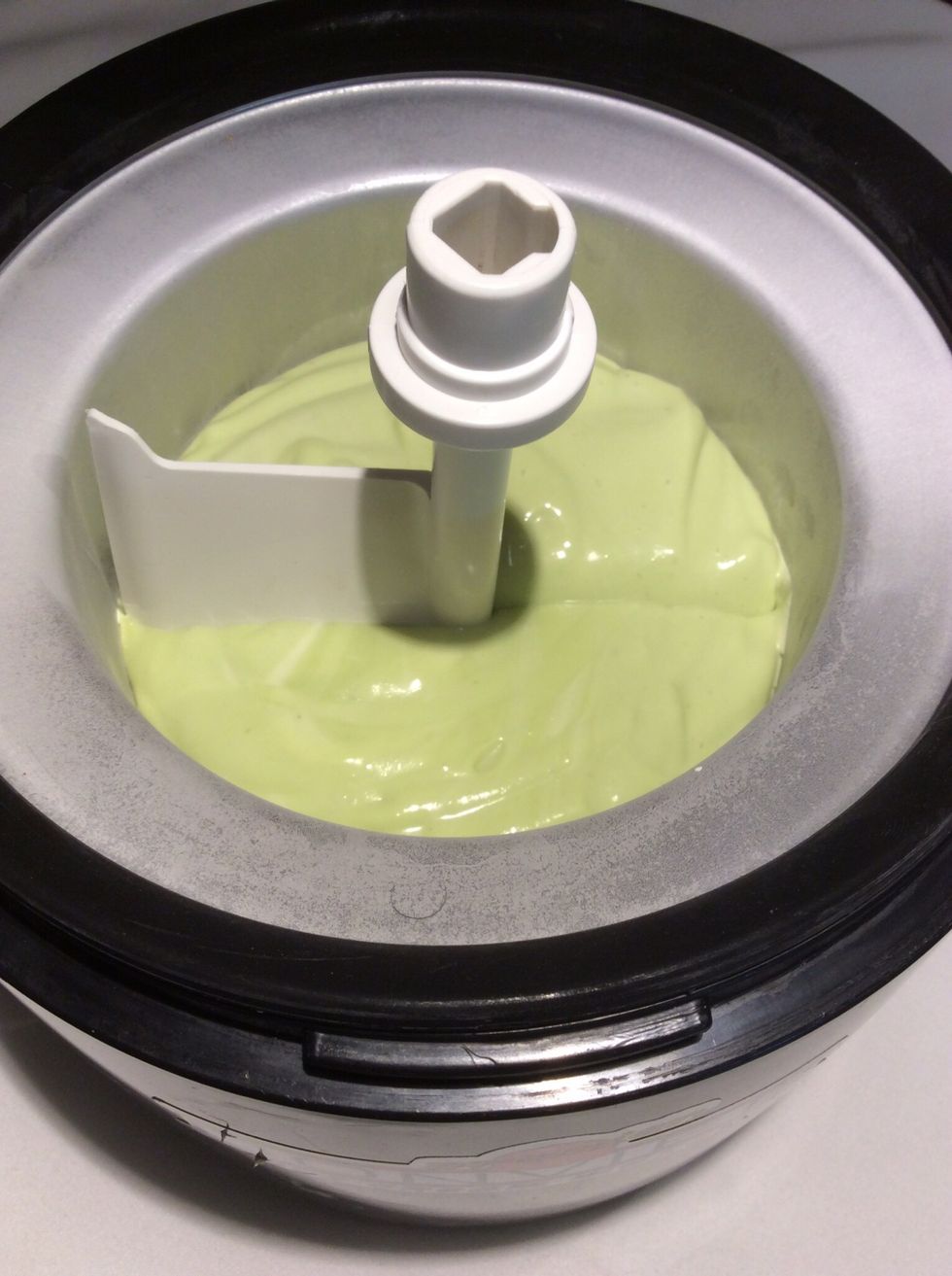The avocado mixture is added to the chiller. Follow the manufacturer's instructions to make your ice cream. I added  a 1/4 cup of shaved milk chocolate halfway through the freezing process.