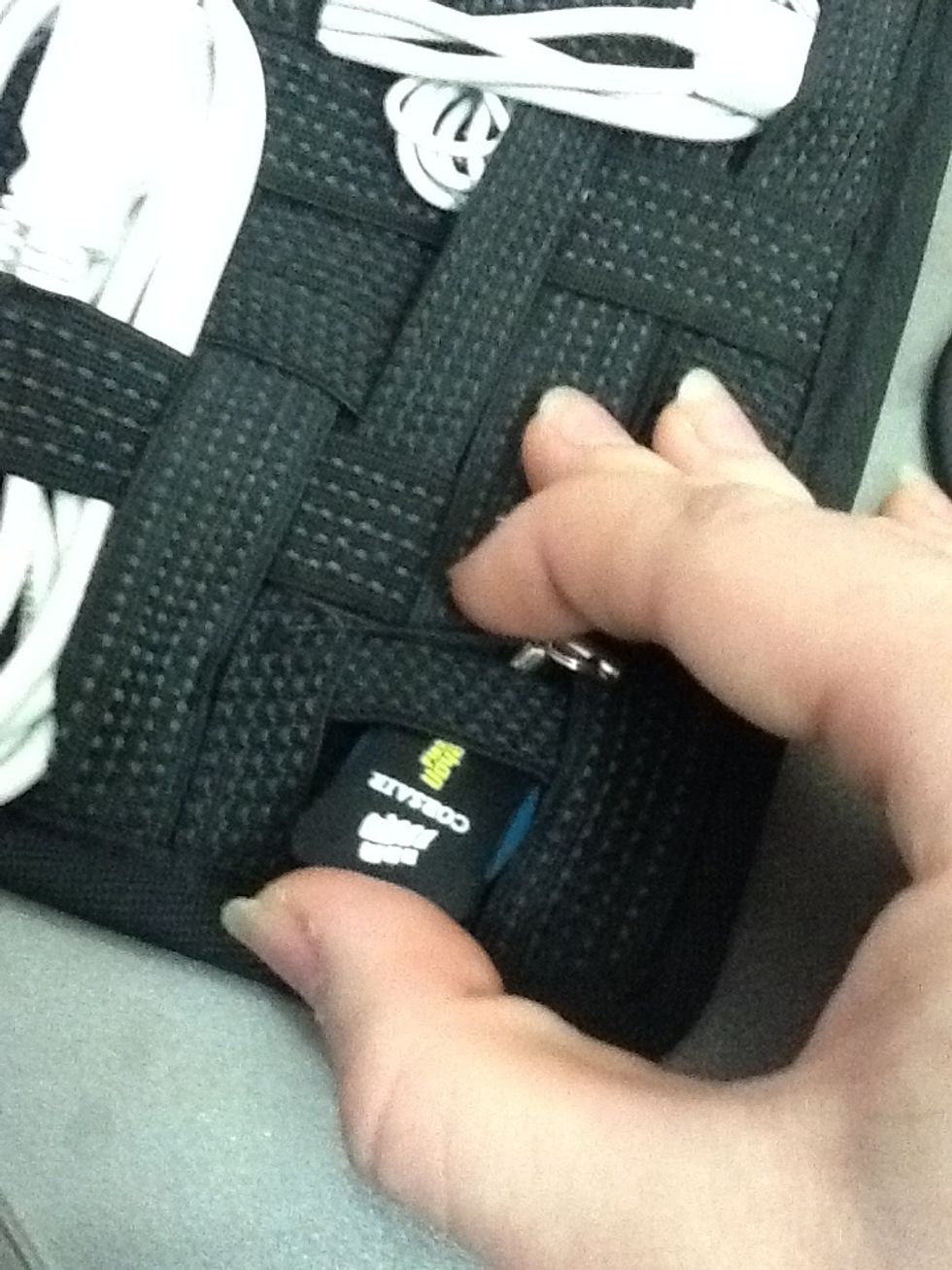 The awesome thing about the weave of elastic bands is that there are places for even the smallest of items, like this inch-long flash drive!