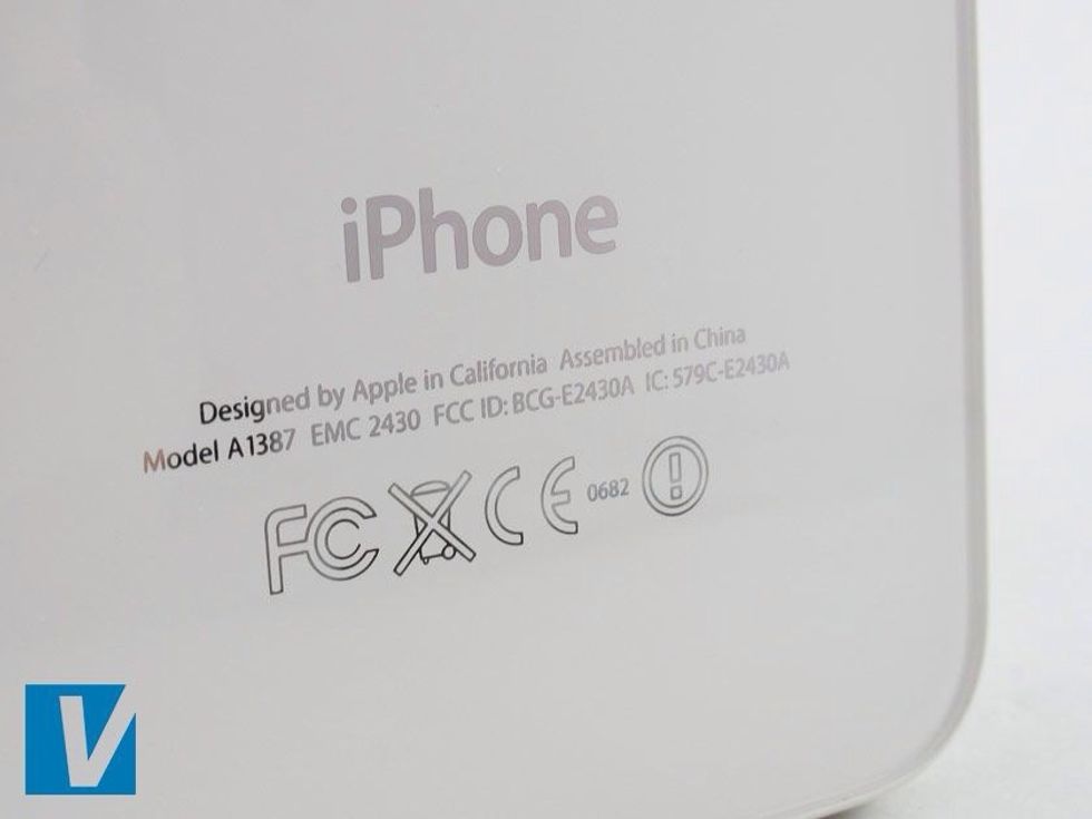 The back of the iPhone features manufacturing details including a set of codes and the model number. Check that the Model and IMEI numbers match those numbers detailed on the retail box label.