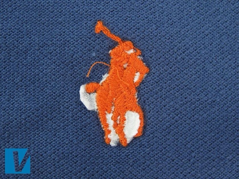 The back of the Polo by Ralph Lauren polo logo should be neatly stitched and finished. There should not be any ink or excessive loose ends. Some loose ends may occur however.
