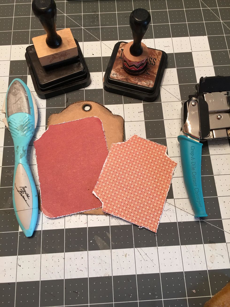 The back side of the kraft tag is not patterned solid but rather has photo mats. Cut one piece 3 1/2" x 4 1/2" and one piece 3" x 4". Distress the edges and tear some of the corners as shown.