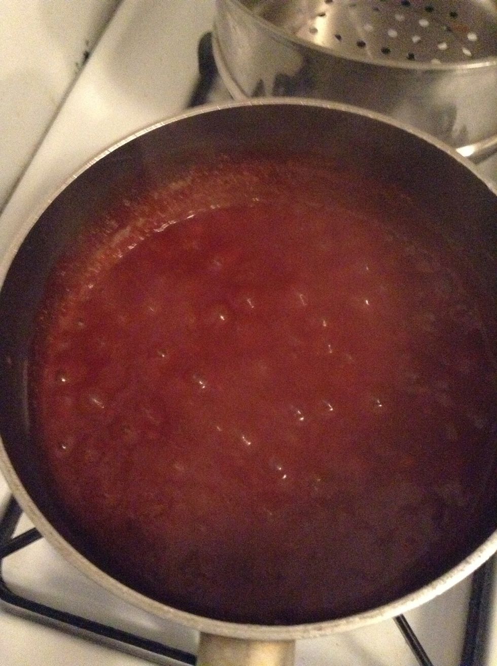 The baked beans should be boiling ... Turn down the fire to a simmer and cover so that it can thicken...give it five mins and turn it off