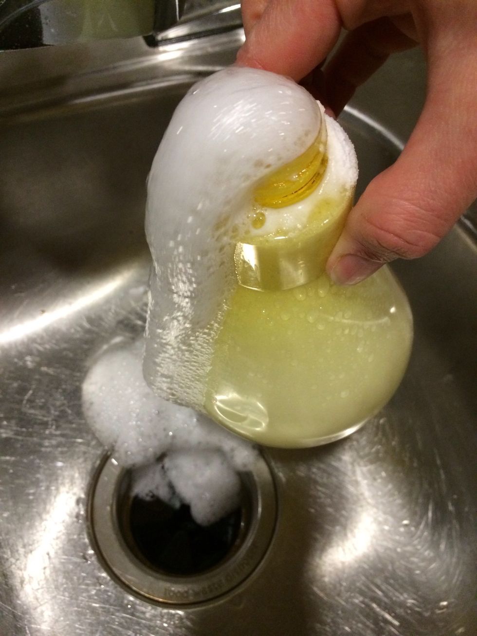 The baking soda is actually turning the vinegar into a foam. Try trapping as much as possible into the bottle when adding water.