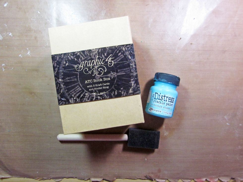 The base for our cart is one of Graphic 45's ATC Book Boxes.   The first step is to paint the box with Distress Crackle Paint.