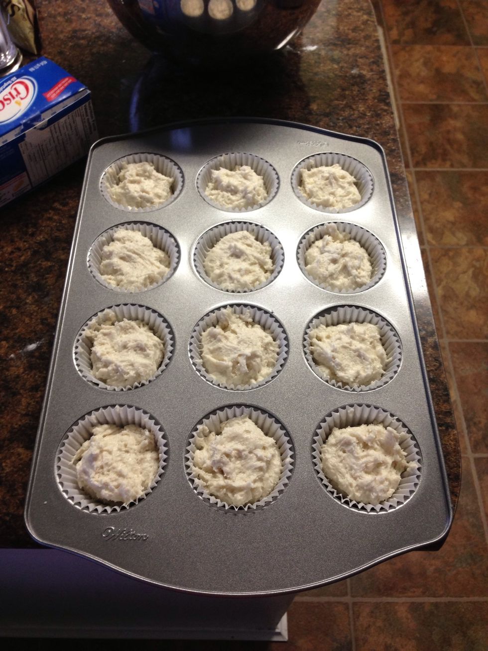 The batter is ready to bake! Fill each muffin cup two thirds full.