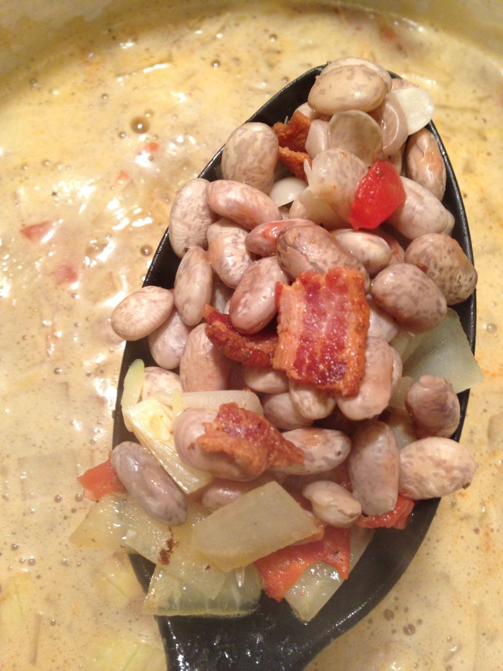 The beer suds will clear & the beans will swell.  Bring the pot to a rolling boil & then lower the temp to simmer/low.  Your beans will cook from 4 to 5 hours.
