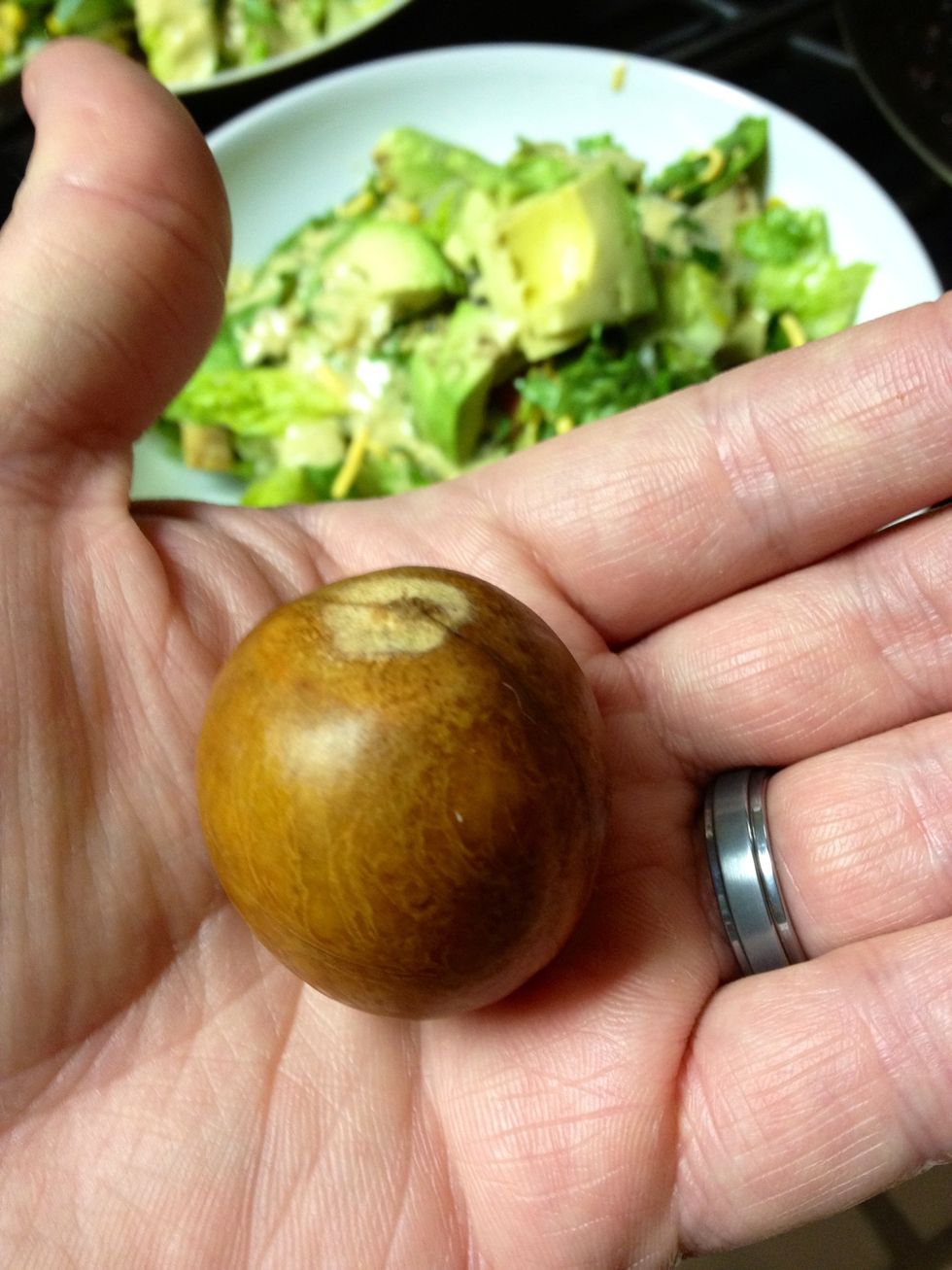 The best way to remove the pit is to slice the knife down on it, stick it, twist it, and pull up from the flesh of the avocado. Works every time!