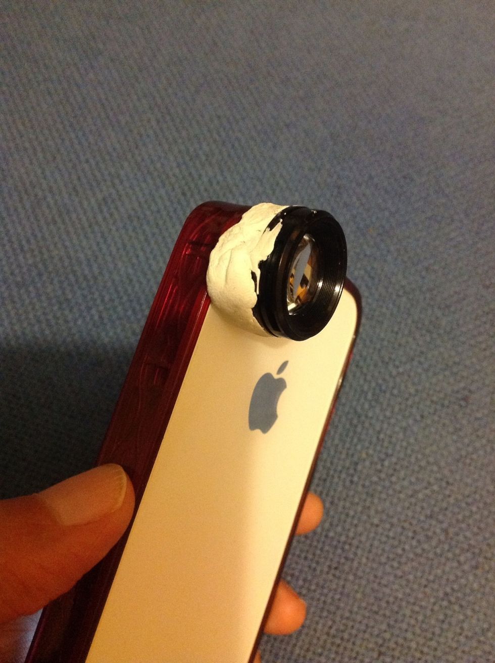 The blu-tack can already adhere the lens to the iPhone securely.