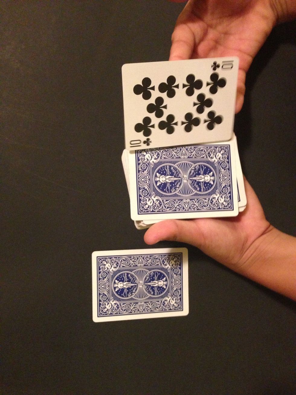 The bottom card is now under the deck, take it and move it to the top