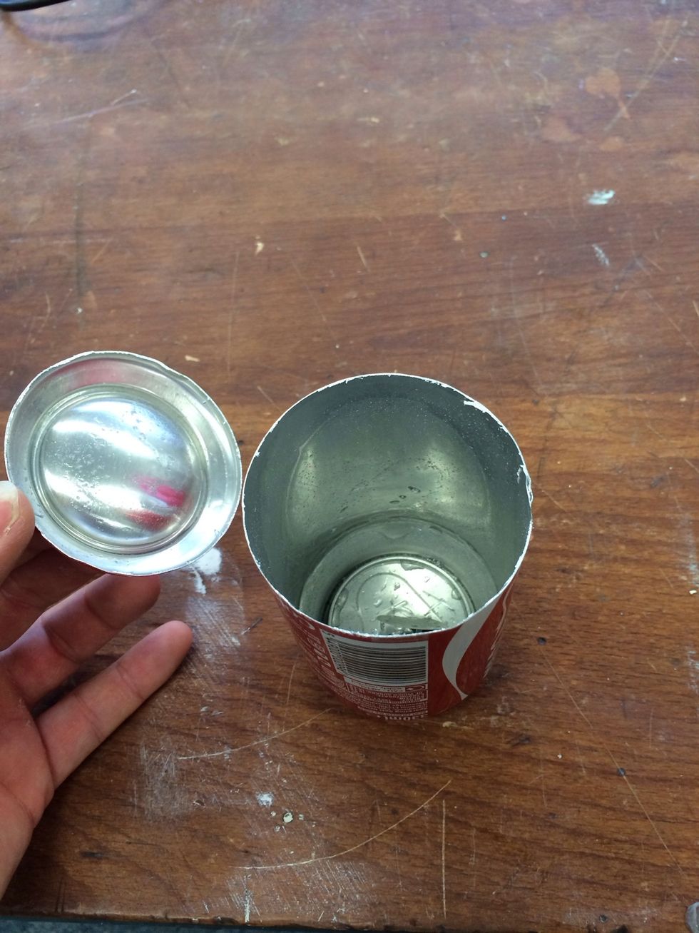 The bottom removed from the can.