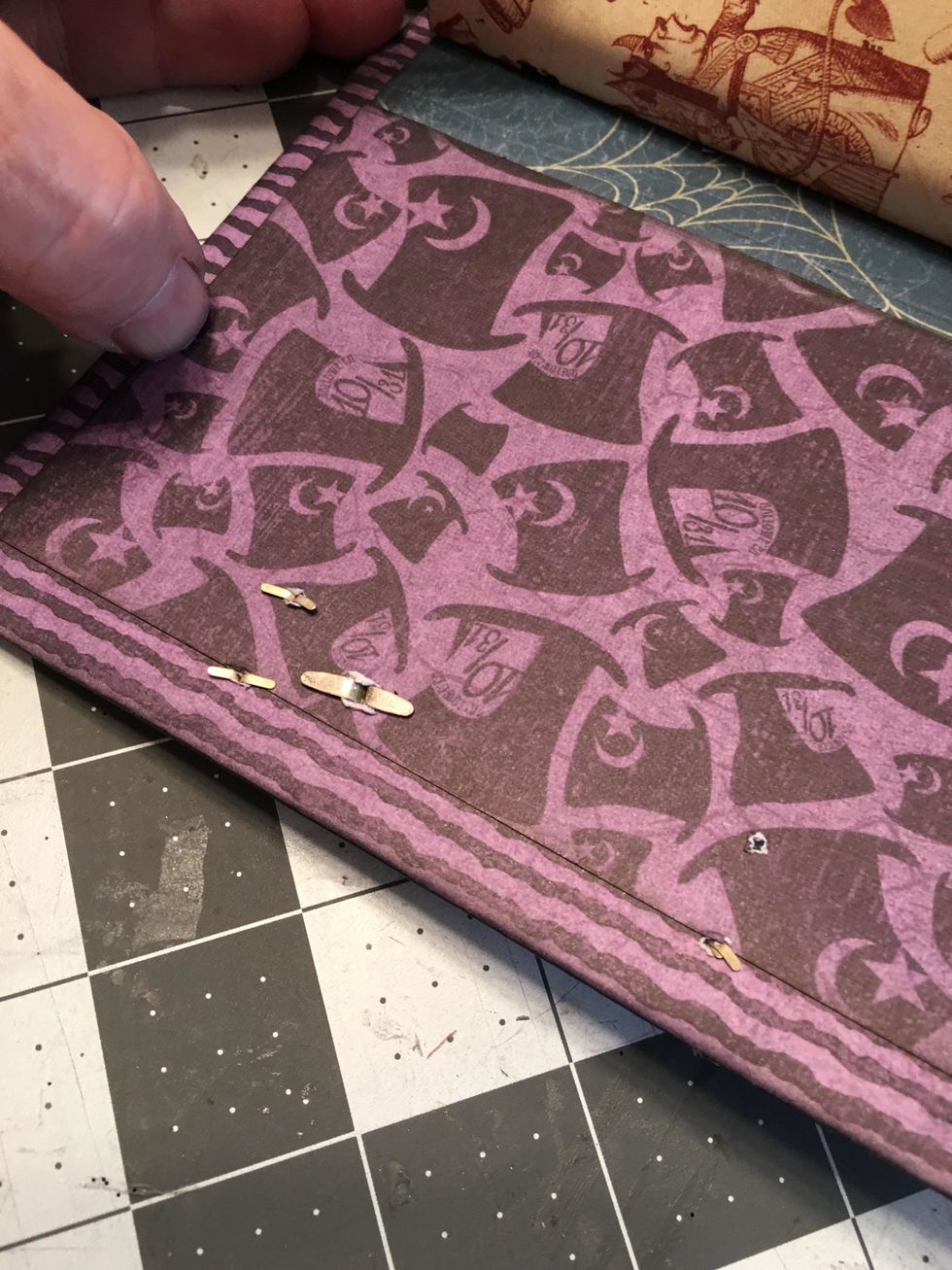 The brads of the door plate and knob will need to be covered on the inside of the front cover.