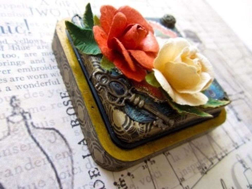 The brass paint will slowly start to distress - adding to the vintage look of the papers I used.