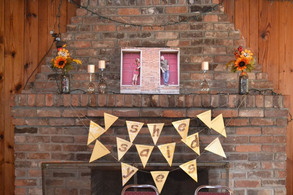 The canvas on the fireplace was done at Walmart in one hour.  It was gifted to the bride after the shower.  The banner was made using scrapbook paper.
