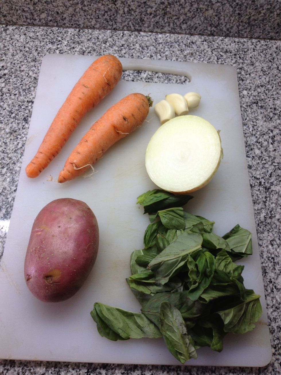 the carrot potato onion garlics and basil