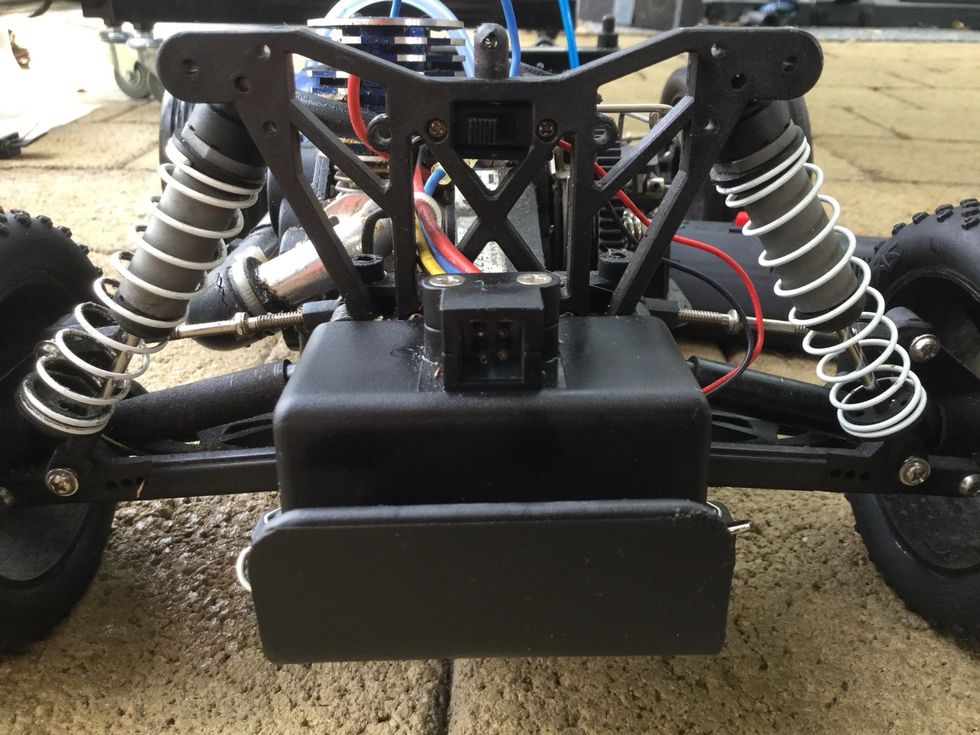 The cars switch should located above the 4 pins to place your batteries