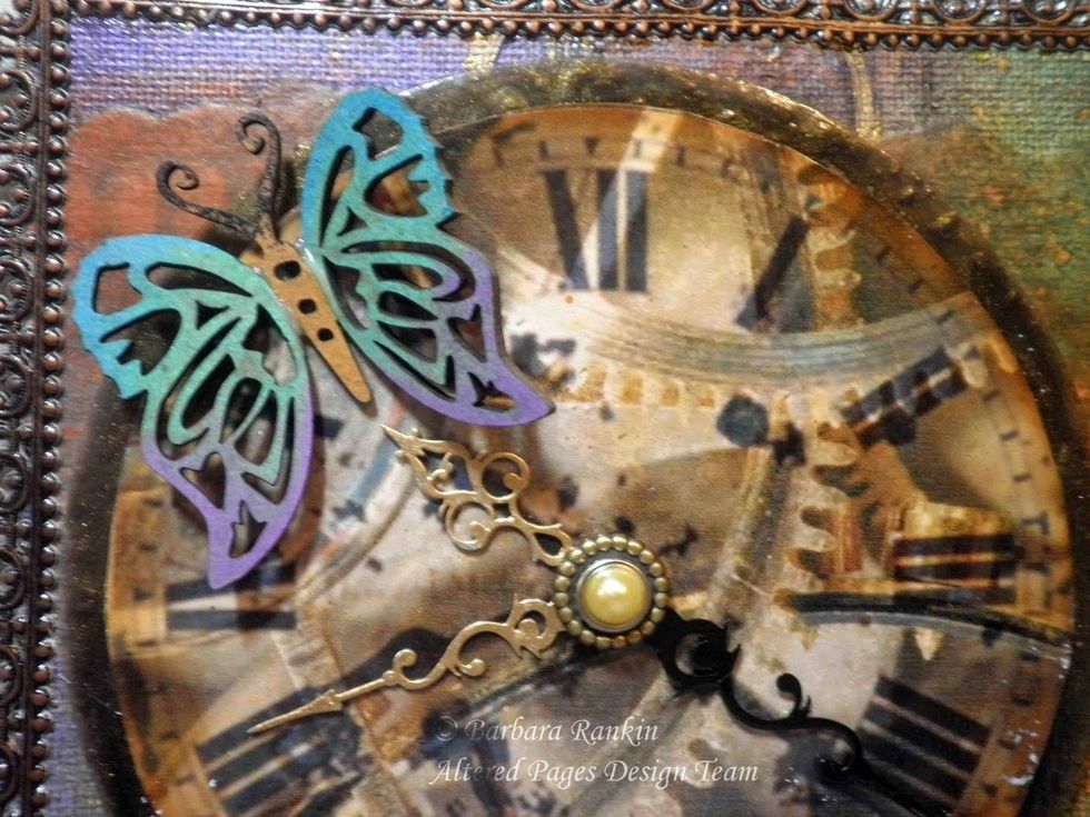 The clock was adhered with pop dots to raise it off of the canvas.