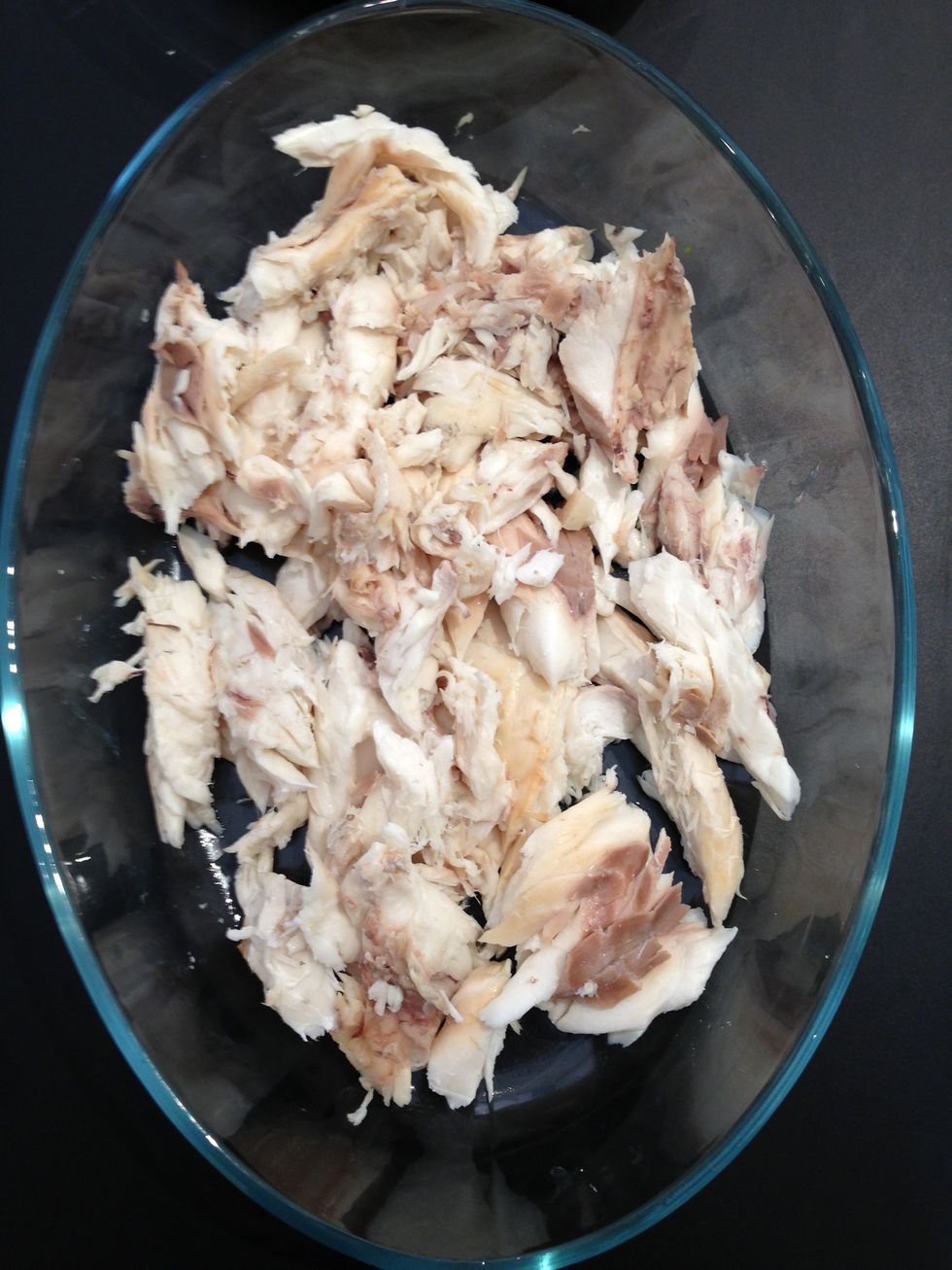 The cooked fish cleaned from the skin and the bones. Keep the head and the tail.