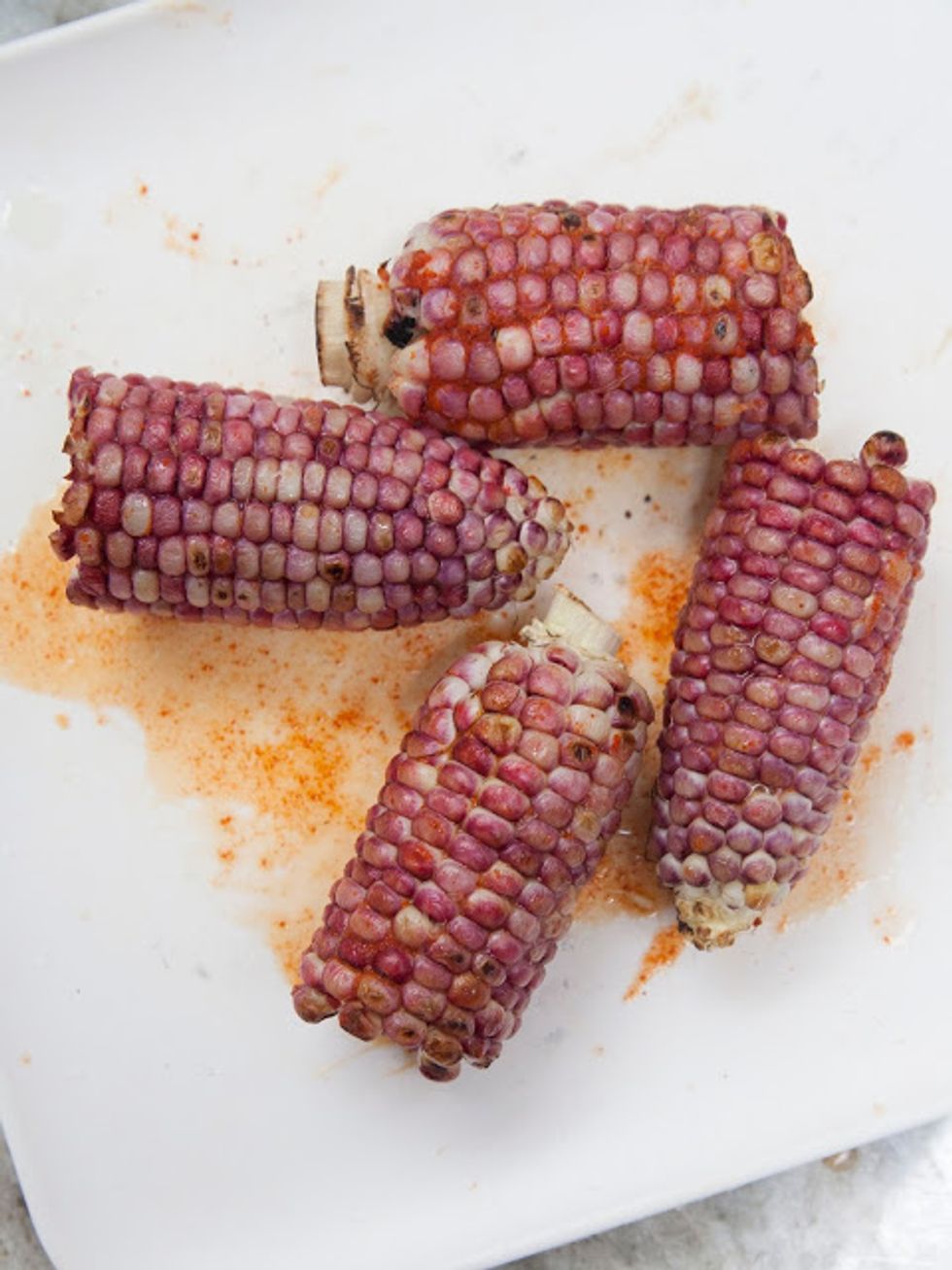 The corn should be coated in chili and lime juice.
