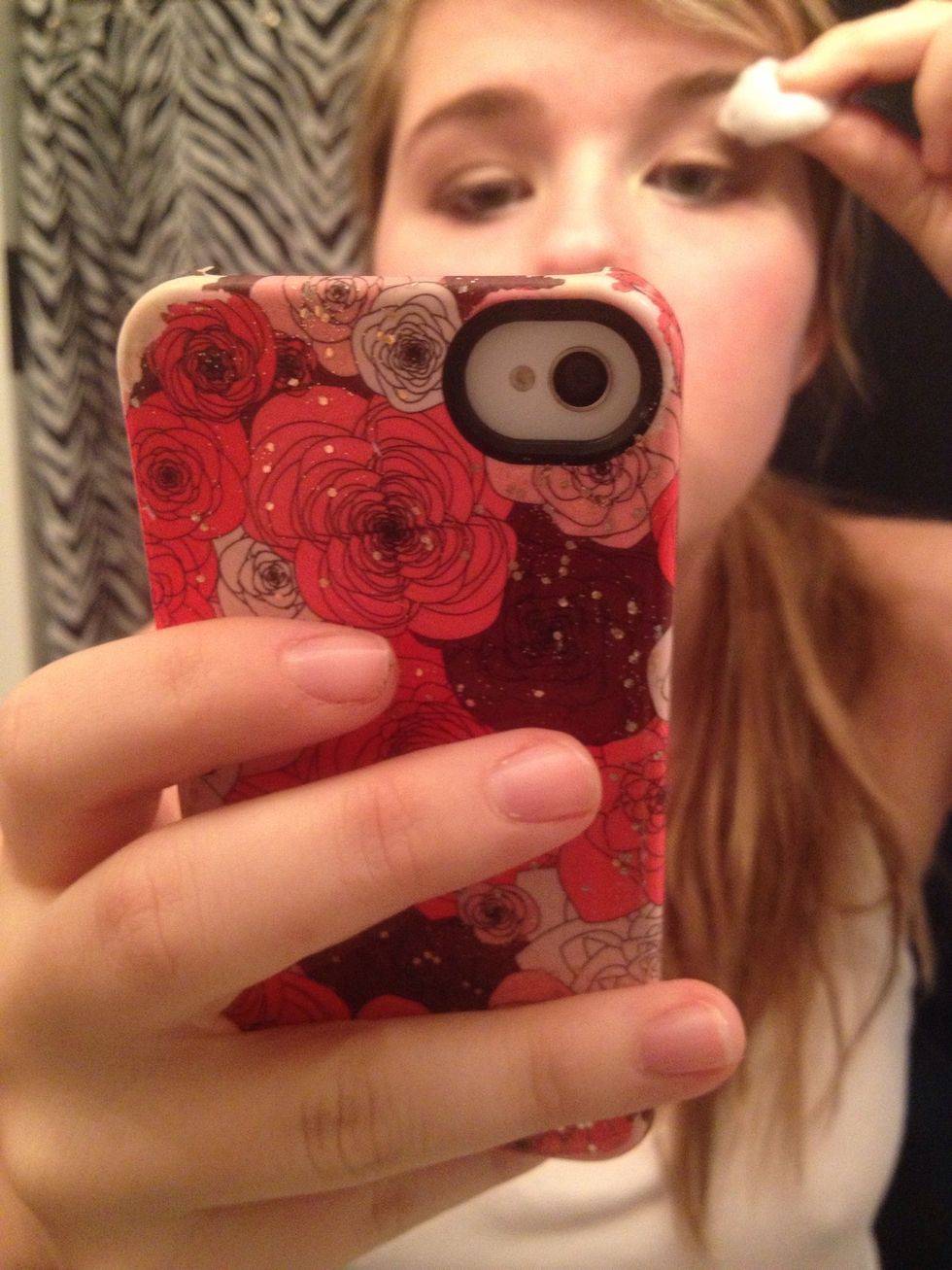 The cotton ball cleans it up, or you can use it to drag the smokiness higher towards your brow