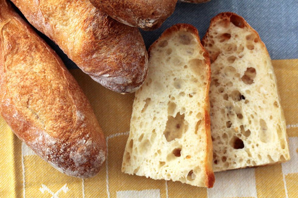 The "crumb" is the texture of the bread. The bread's crumb can be "holey" or have a cake-like fine crumb, depending on the hydration level. With more water a dough will have more bubbles (more holes).