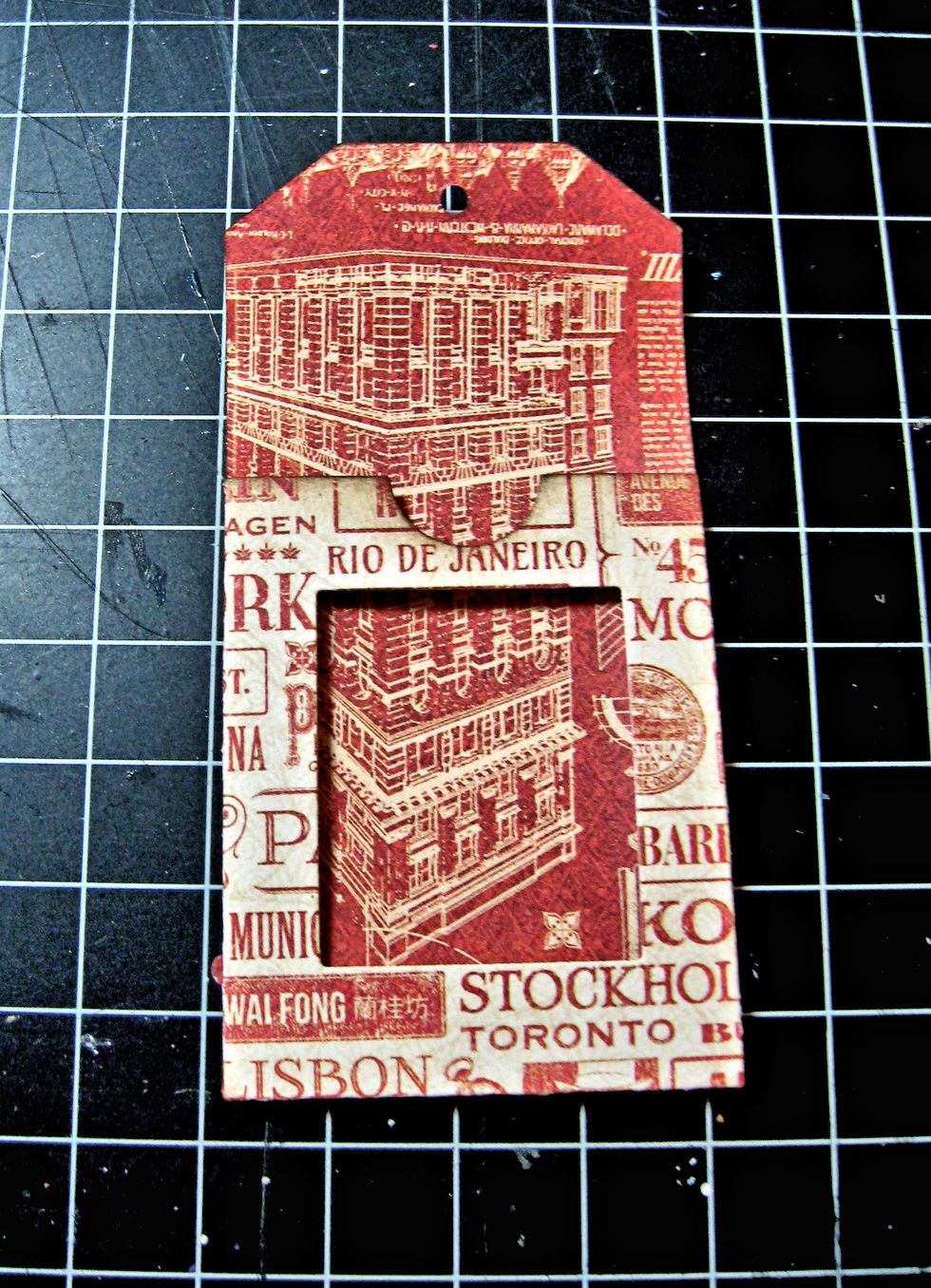 The die automatically creates a brad hole. I decided not to use a brad closure and opted for a magnetic closure instead.