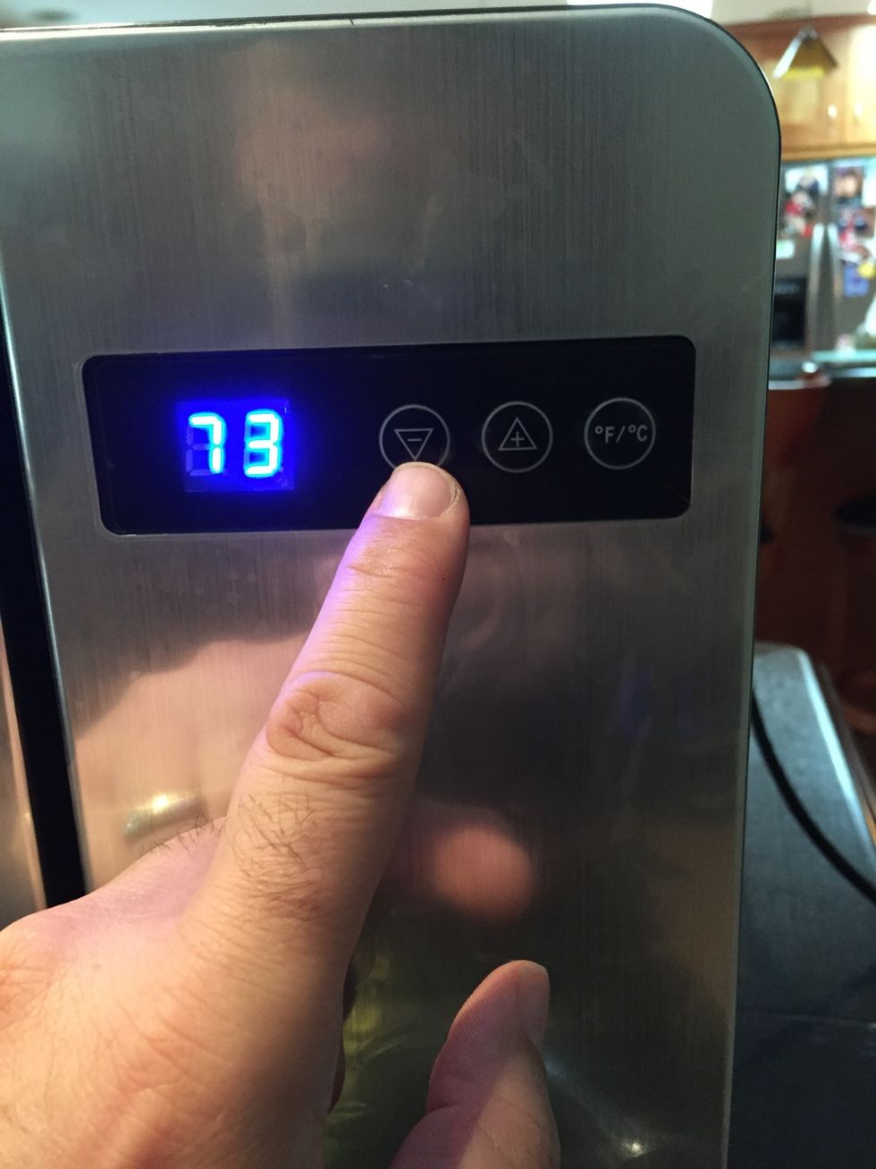 The digital display shows the current temperature. Press the up/down button to adjust temperature. Set the temperature to 34F (1C). The lower the temperature the less foam.