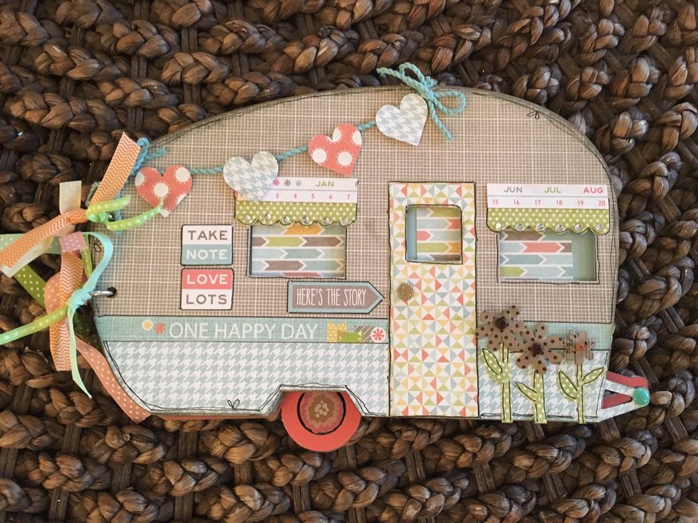 The door is cut from left over paper. The size is- 1 1/2 x 4" Attach the blue twine for banner with a thin strip of Liquid Glass. When dry attach hearts in your accessory pack. Pop with 3D tape.