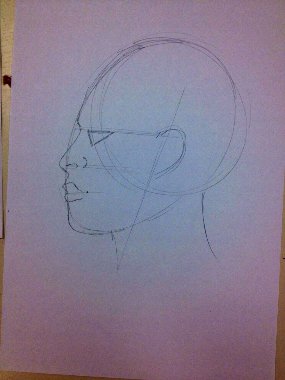 The edge of the lip lines up with the front if the eye.