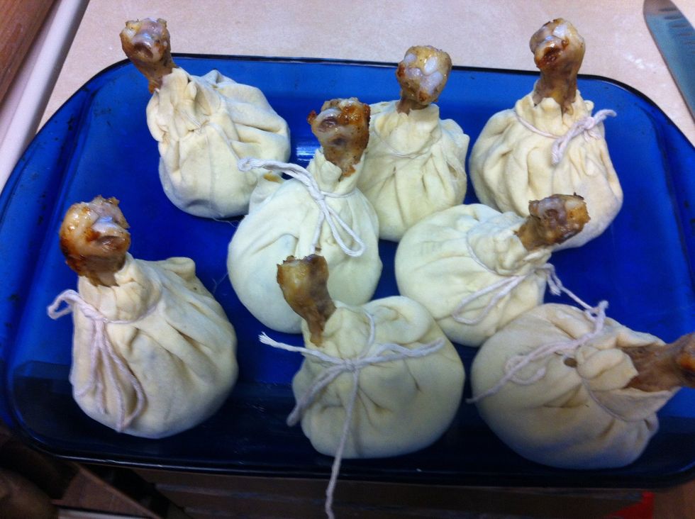 The edges of the dough to gather and tie the thread (not very tight tie.)  Slightly butter baking sheet.